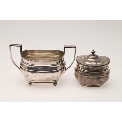 94 - A GEORGE V SILVER TEA POT & MATCHING SUGAR BASIN. rounded rectangular form, with angular handles and... 