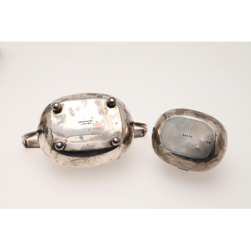 94 - A GEORGE V SILVER TEA POT & MATCHING SUGAR BASIN. rounded rectangular form, with angular handles and... 