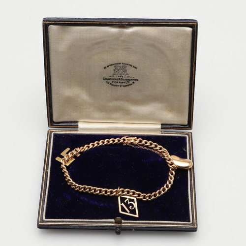 475 - A 15CT GOLD CURB LINK BRACELET. suspending three gold charms, 18.5cm long, 17.7 grams.