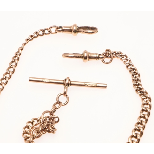 488 - A 9CT GOLD CURB LINK WATCH CHAIN. each link stamped 9 375, suspending a 9ct gold 't' bar, 39cm long,... 