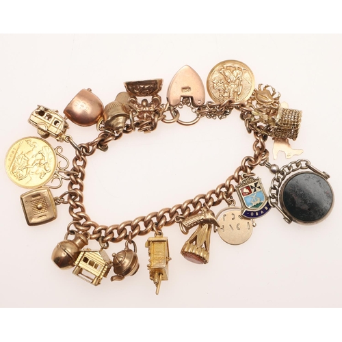 497 - A 9CT GOLD CURB LINK CHARM BRACELET. each link stamped 9 375, with padlock clasp and suspending many... 