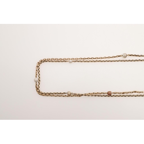 501 - A 9CT GOLD LONG GUARD CHAIN. formed with oval-shaped links and mounted with small pearl beads, 146cm... 