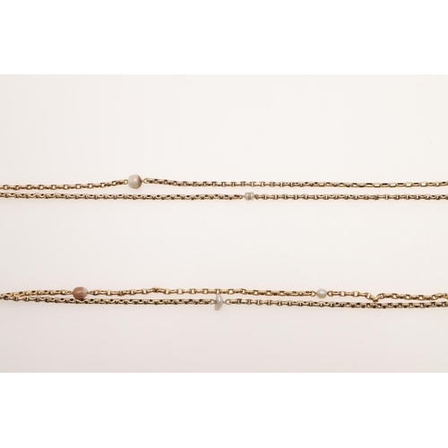 501 - A 9CT GOLD LONG GUARD CHAIN. formed with oval-shaped links and mounted with small pearl beads, 146cm... 