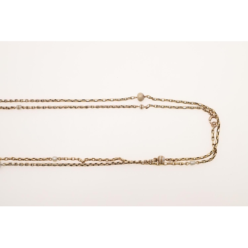 501 - A 9CT GOLD LONG GUARD CHAIN. formed with oval-shaped links and mounted with small pearl beads, 146cm... 