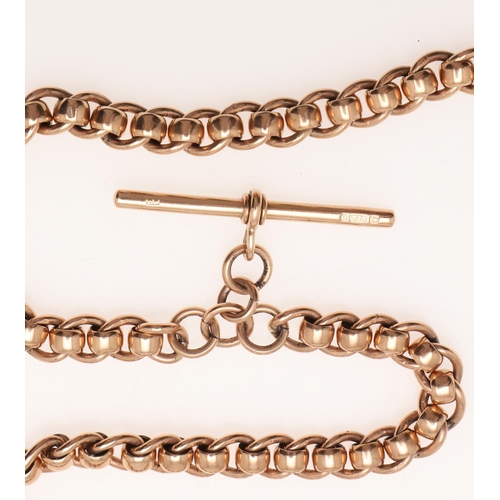 502 - A 9CT GOLD FANCY LINK WATCHCHAIN. suspending a 9ct gold 't' bar, 41.5cm long, 47 grams.