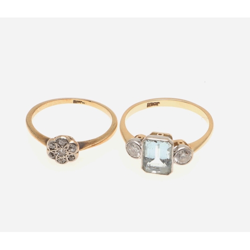 509 - AN AQUAMARINE AND DIAMOND THREE STONE RING. the step-cut aquamarine is set with two circular-cut dia... 