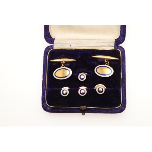 523 - A PAIR OF GOLD AND ENAMEL CUFFLINKS. each formed with an oval-shaped link with white and blue enamel... 