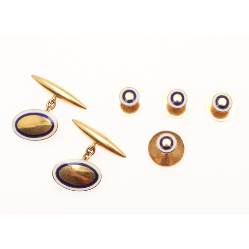 523 - A PAIR OF GOLD AND ENAMEL CUFFLINKS. each formed with an oval-shaped link with white and blue enamel... 