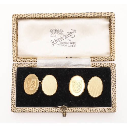 526 - A PAIR OF 18CT GOLD CUFFLINKS. of oval shape, each with engine turned decoration and engraved with a... 