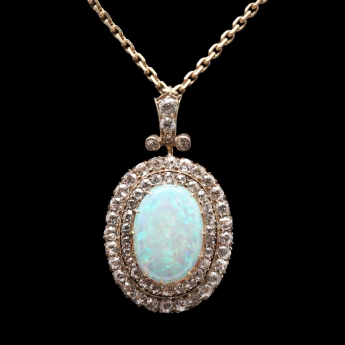 852 - AN OPAL AND DIAMOND BROOCH PENDANT. the oval-shaped solid white opal is set within a double surround... 