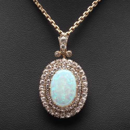 852 - AN OPAL AND DIAMOND BROOCH PENDANT. the oval-shaped solid white opal is set within a double surround... 