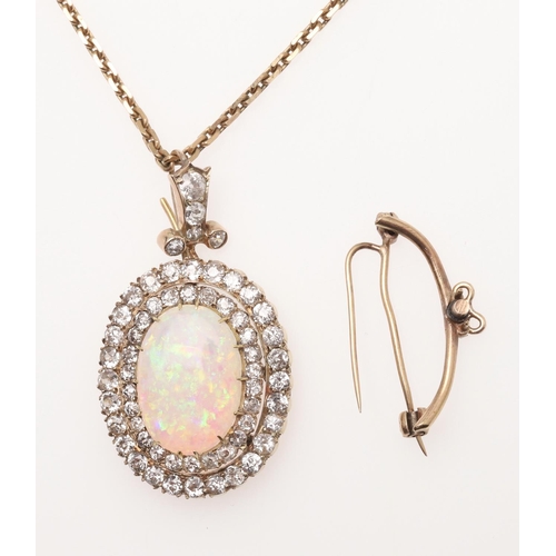 852 - AN OPAL AND DIAMOND BROOCH PENDANT. the oval-shaped solid white opal is set within a double surround... 