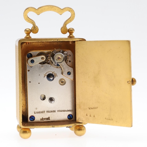 858 - A FRENCH MINIATURE GILT METAL TRAVELLING TIMEPIECE. late 19th/early 20th century, the case with carr... 