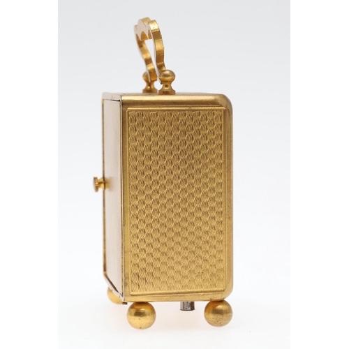 858 - A FRENCH MINIATURE GILT METAL TRAVELLING TIMEPIECE. late 19th/early 20th century, the case with carr... 
