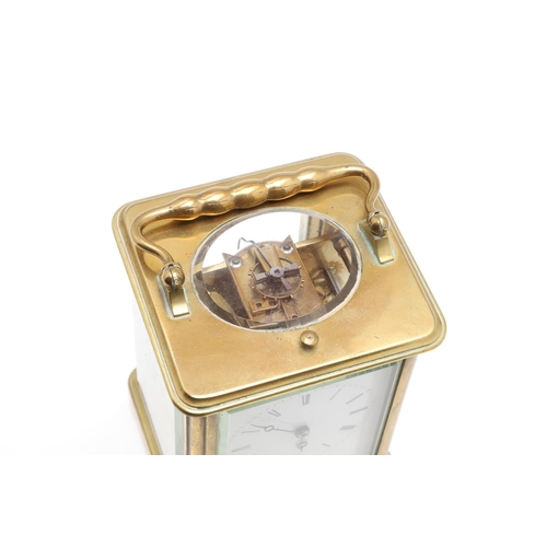 859 - AN EARLY 20TH CENTURY BRASS REPEATER ALARM CARRIAGE CLOCK. late 19th century, the enamel dial signed... 