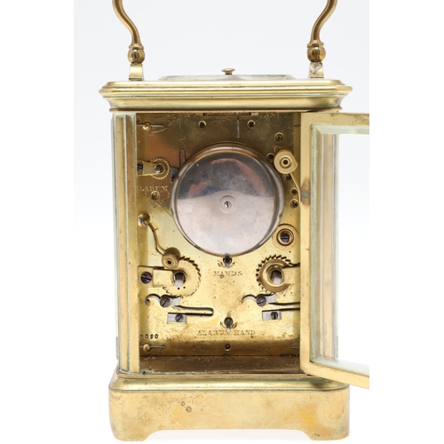 859 - AN EARLY 20TH CENTURY BRASS REPEATER ALARM CARRIAGE CLOCK. late 19th century, the enamel dial signed... 