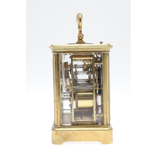 859 - AN EARLY 20TH CENTURY BRASS REPEATER ALARM CARRIAGE CLOCK. late 19th century, the enamel dial signed... 