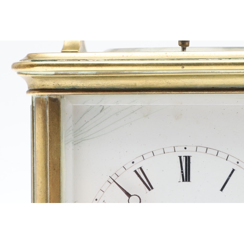 859 - AN EARLY 20TH CENTURY BRASS REPEATER ALARM CARRIAGE CLOCK. late 19th century, the enamel dial signed... 