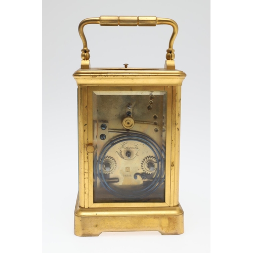 860 - A LATE 19TH CENTURY FRENCH BRASS REPEATER CARRIAGE CLOCK. by Henri Jacot,having a white enamel Roman... 