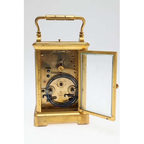 860 - A LATE 19TH CENTURY FRENCH BRASS REPEATER CARRIAGE CLOCK. by Henri Jacot,having a white enamel Roman... 