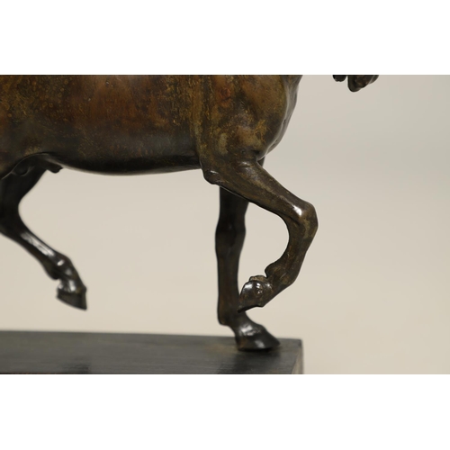 878 - AFTER GIAMBOLOGNA (1529-1608), BRONZE OF A PACING HORSE. early 20th century, light brown patina, upo... 
