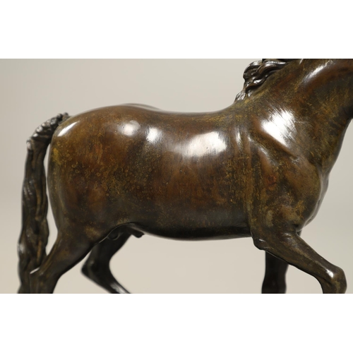 878 - AFTER GIAMBOLOGNA (1529-1608), BRONZE OF A PACING HORSE. early 20th century, light brown patina, upo... 