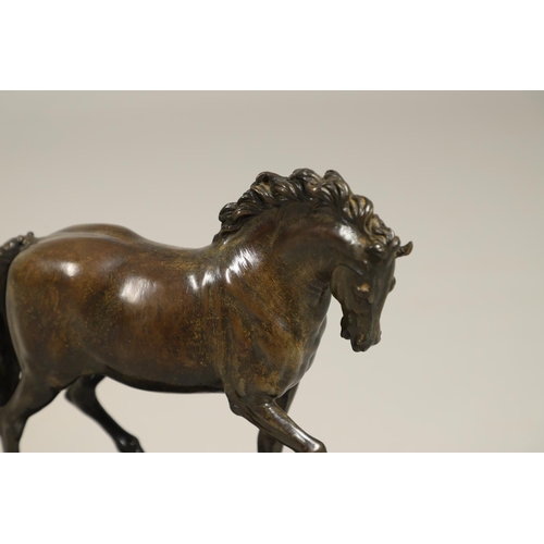 878 - AFTER GIAMBOLOGNA (1529-1608), BRONZE OF A PACING HORSE. early 20th century, light brown patina, upo... 