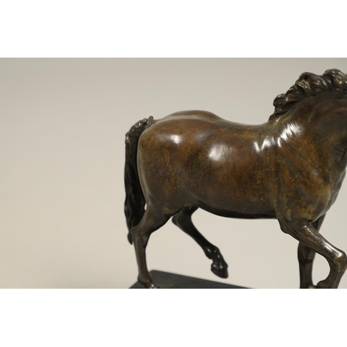 878 - AFTER GIAMBOLOGNA (1529-1608), BRONZE OF A PACING HORSE. early 20th century, light brown patina, upo... 