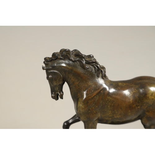 878 - AFTER GIAMBOLOGNA (1529-1608), BRONZE OF A PACING HORSE. early 20th century, light brown patina, upo... 