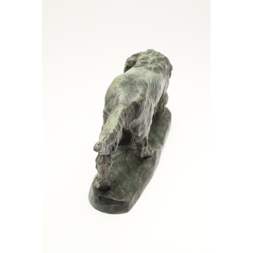 879 - AFTER THOMAS FRANCOIS CARTIER (1879 - 1943). bronze of a Setter, with green painted finish, signed T... 