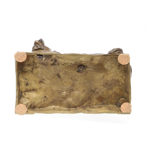 881 - A LATE 19TH CENTURY CONTINENTAL BRONZE OF A BARKING DOG. modelled in a seated pose upon a naturalist... 