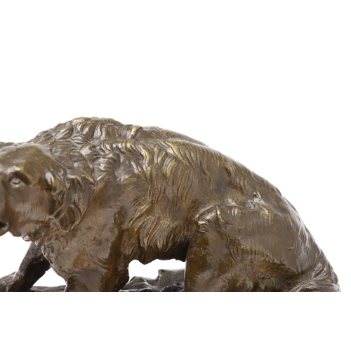 881 - A LATE 19TH CENTURY CONTINENTAL BRONZE OF A BARKING DOG. modelled in a seated pose upon a naturalist... 