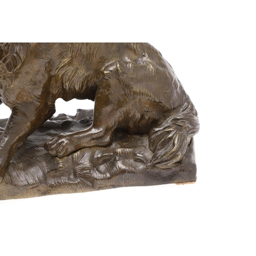 881 - A LATE 19TH CENTURY CONTINENTAL BRONZE OF A BARKING DOG. modelled in a seated pose upon a naturalist... 
