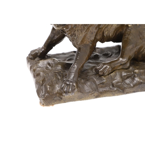 881 - A LATE 19TH CENTURY CONTINENTAL BRONZE OF A BARKING DOG. modelled in a seated pose upon a naturalist... 