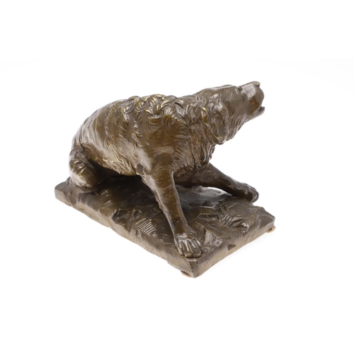 881 - A LATE 19TH CENTURY CONTINENTAL BRONZE OF A BARKING DOG. modelled in a seated pose upon a naturalist... 