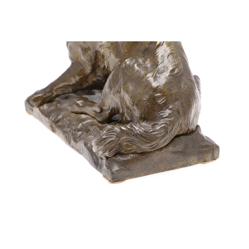 881 - A LATE 19TH CENTURY CONTINENTAL BRONZE OF A BARKING DOG. modelled in a seated pose upon a naturalist... 