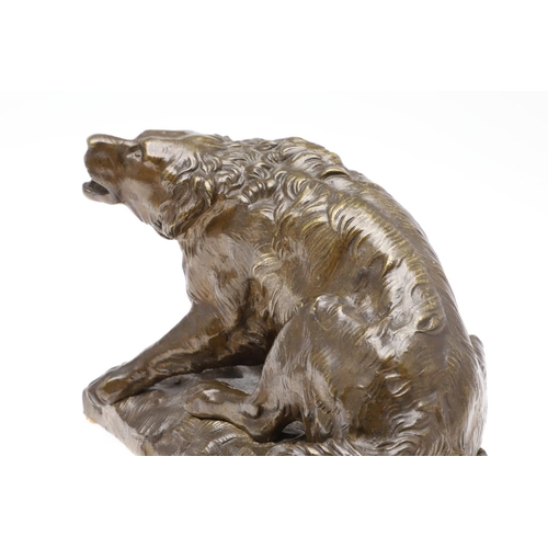 881 - A LATE 19TH CENTURY CONTINENTAL BRONZE OF A BARKING DOG. modelled in a seated pose upon a naturalist... 