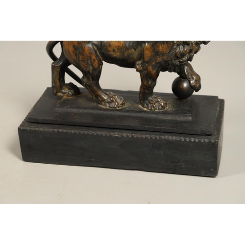 882 - A GRAND TOUR BRONZE OF THE MEDICI LION. 18th/19th century, well worn brown patina, upon later ebonis... 