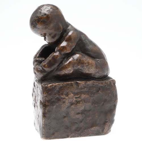 883 - REGINALD FAIRFAX WELLS (1877 - 1951), 'CHILD ON A CUSHION', CIRCA 1900. a rare patinated bronze, sig... 