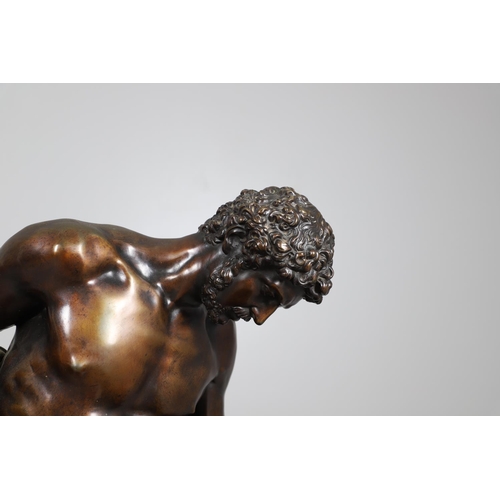 885 - AFTER PIERRE JULIEN (1731 - 1804), A LARGE BRONZE STUDY, THE DYING GAUL. the wounded figure collapse... 
