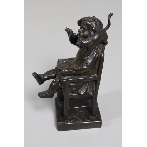 887 - AFTER HENRI FUGERE (1872-1944), BRONZE OF A CHILD. modelled as a seated girl, feeding herself with a... 