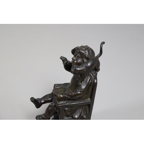887 - AFTER HENRI FUGERE (1872-1944), BRONZE OF A CHILD. modelled as a seated girl, feeding herself with a... 