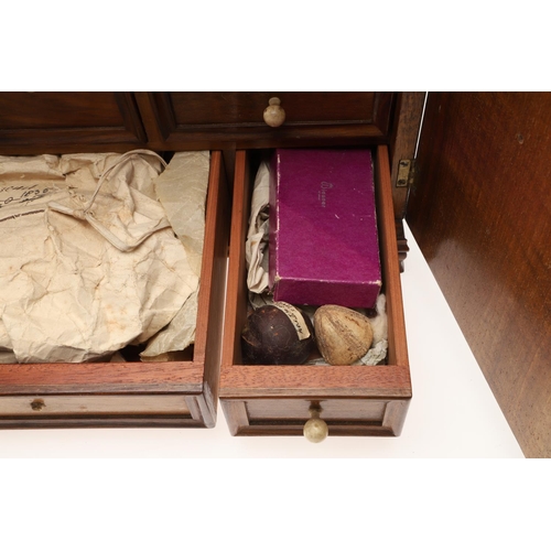 890 - A 19TH CENTURY WALNUT TABLE TOP COLLECTOR'S CABINET. the doors with brass sliding locks enclosing ni... 