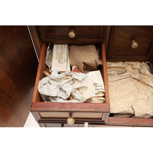 890 - A 19TH CENTURY WALNUT TABLE TOP COLLECTOR'S CABINET. the doors with brass sliding locks enclosing ni... 