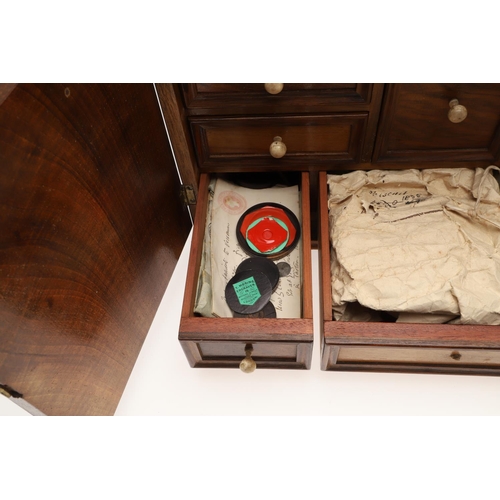 890 - A 19TH CENTURY WALNUT TABLE TOP COLLECTOR'S CABINET. the doors with brass sliding locks enclosing ni... 