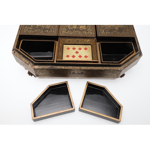 903 - A CHINESE EXPORT LACQUERED GAMES BOX. 19th century, of octagonal form containing seven lidded compar... 