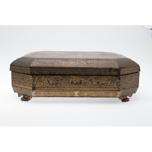903 - A CHINESE EXPORT LACQUERED GAMES BOX. 19th century, of octagonal form containing seven lidded compar... 