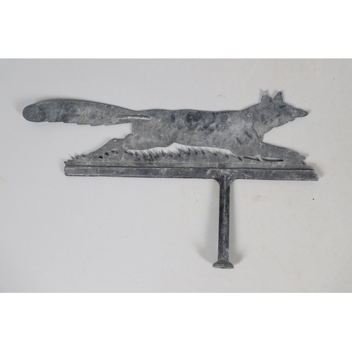 904 - A PAINTED CAST IRON WEATHER VANE. in the form of a running fox, height 47cm, width 76cm.