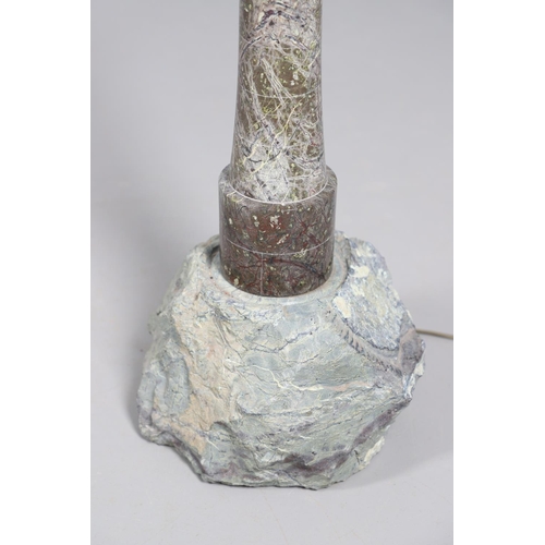 907 - A CORNISH SERPENTINE STONE TABLE LAMP. in the form of a lighthouse upon a rough cut stone base with ... 