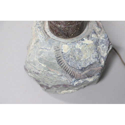 907 - A CORNISH SERPENTINE STONE TABLE LAMP. in the form of a lighthouse upon a rough cut stone base with ... 